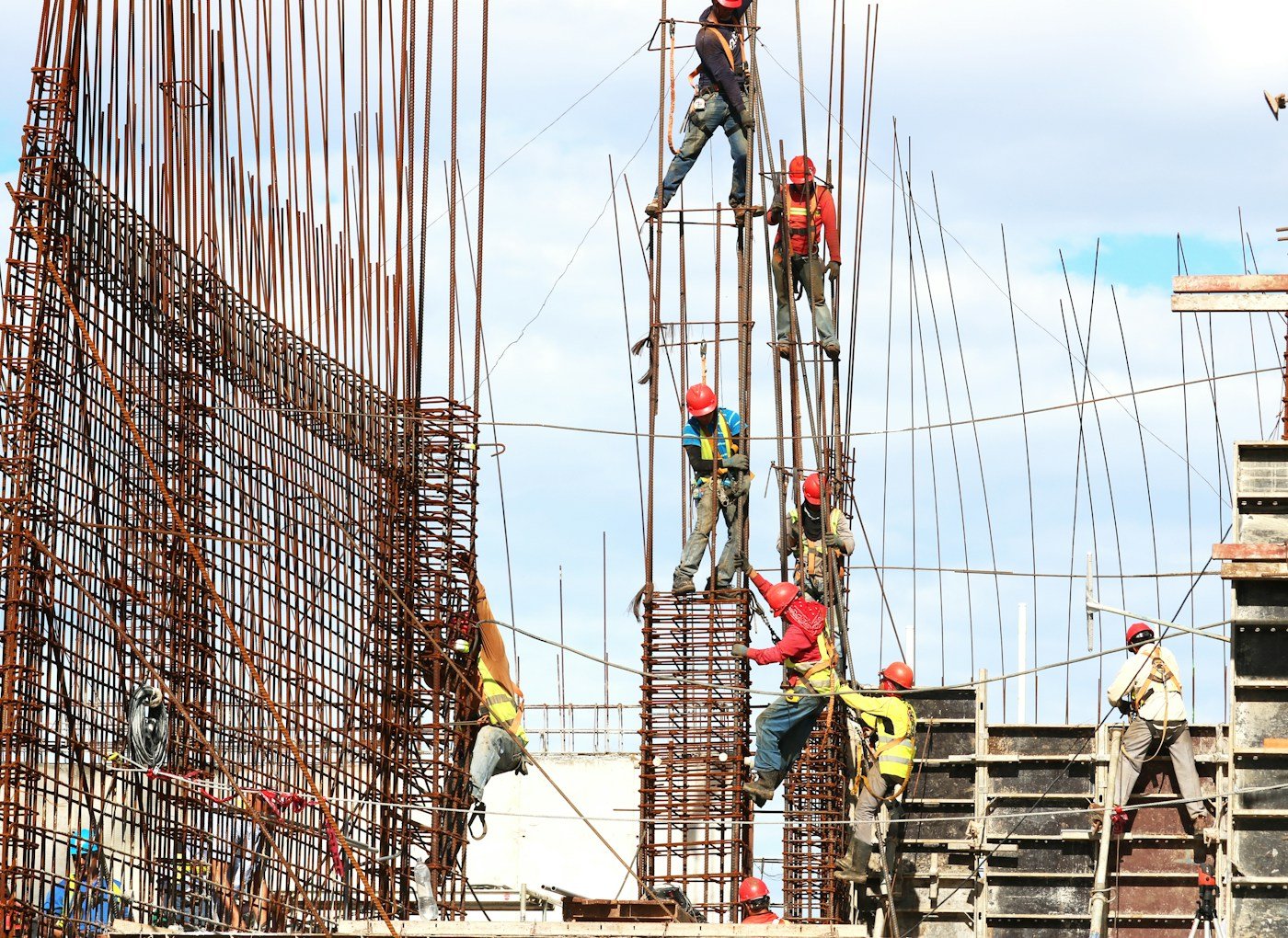 Construction site with workers and structural building work in progress